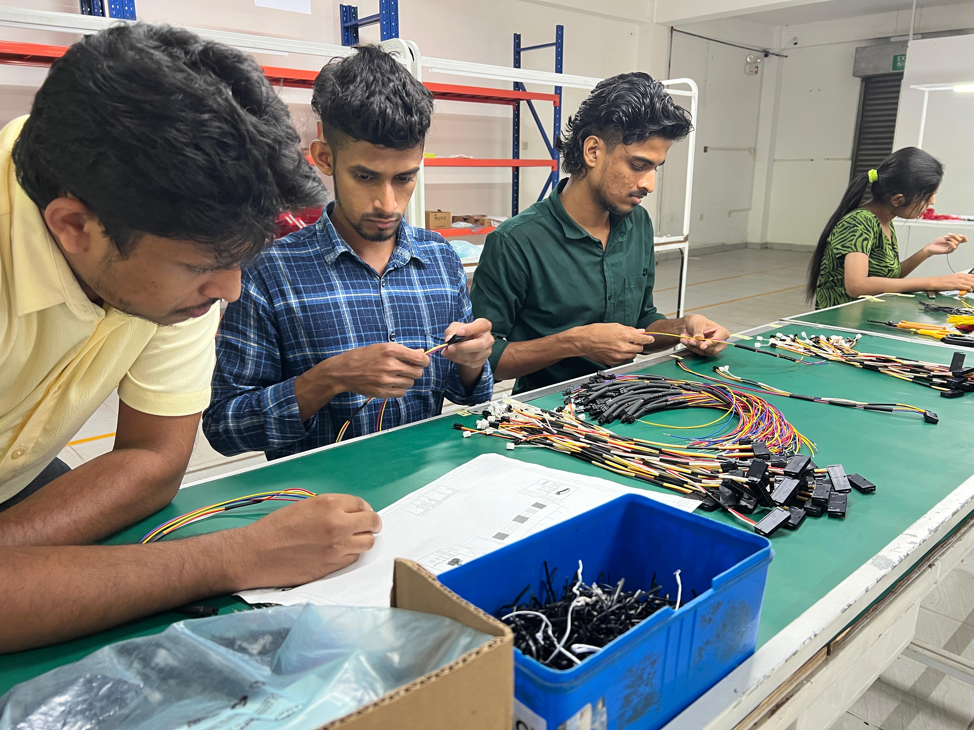 LTM team assembling wire harnesses